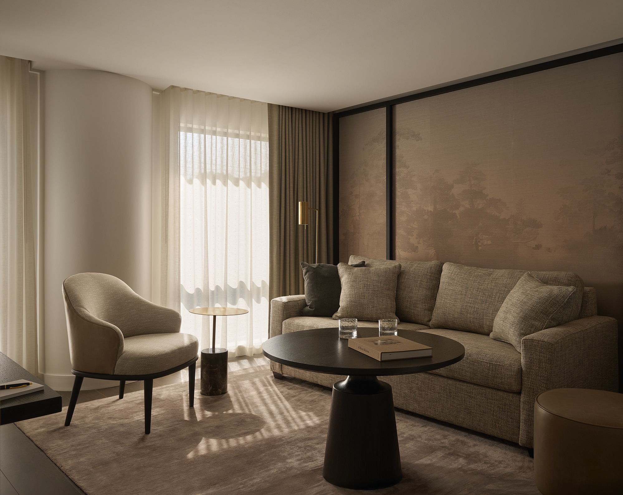 A light-filled sitting area in a Glenhill Hotel suite