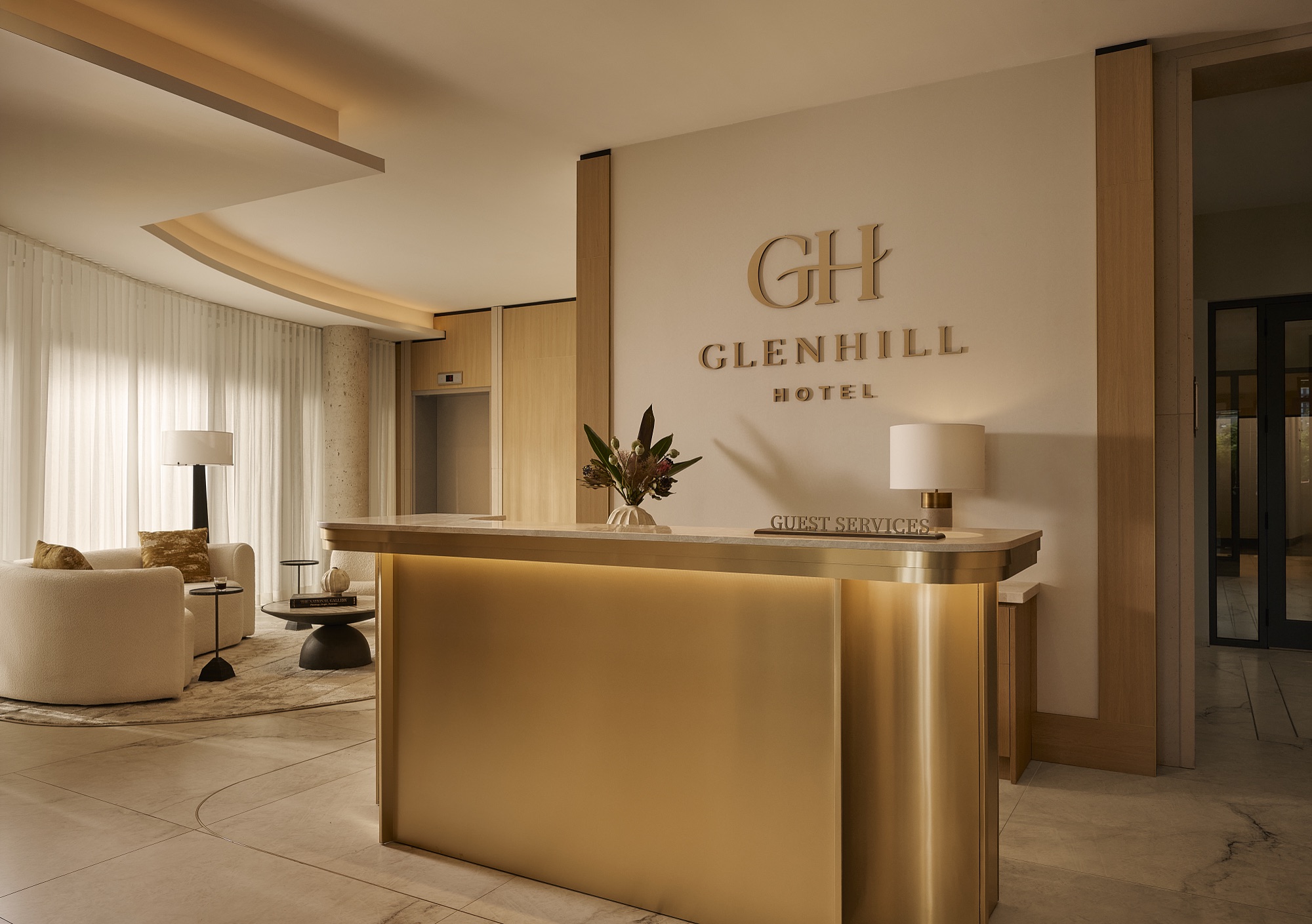 The lobby and guest services desk at Glenhill Hotel